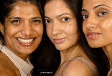 Indian woman applying skincare cream on face in natural light – skincare routine for Indian skin
